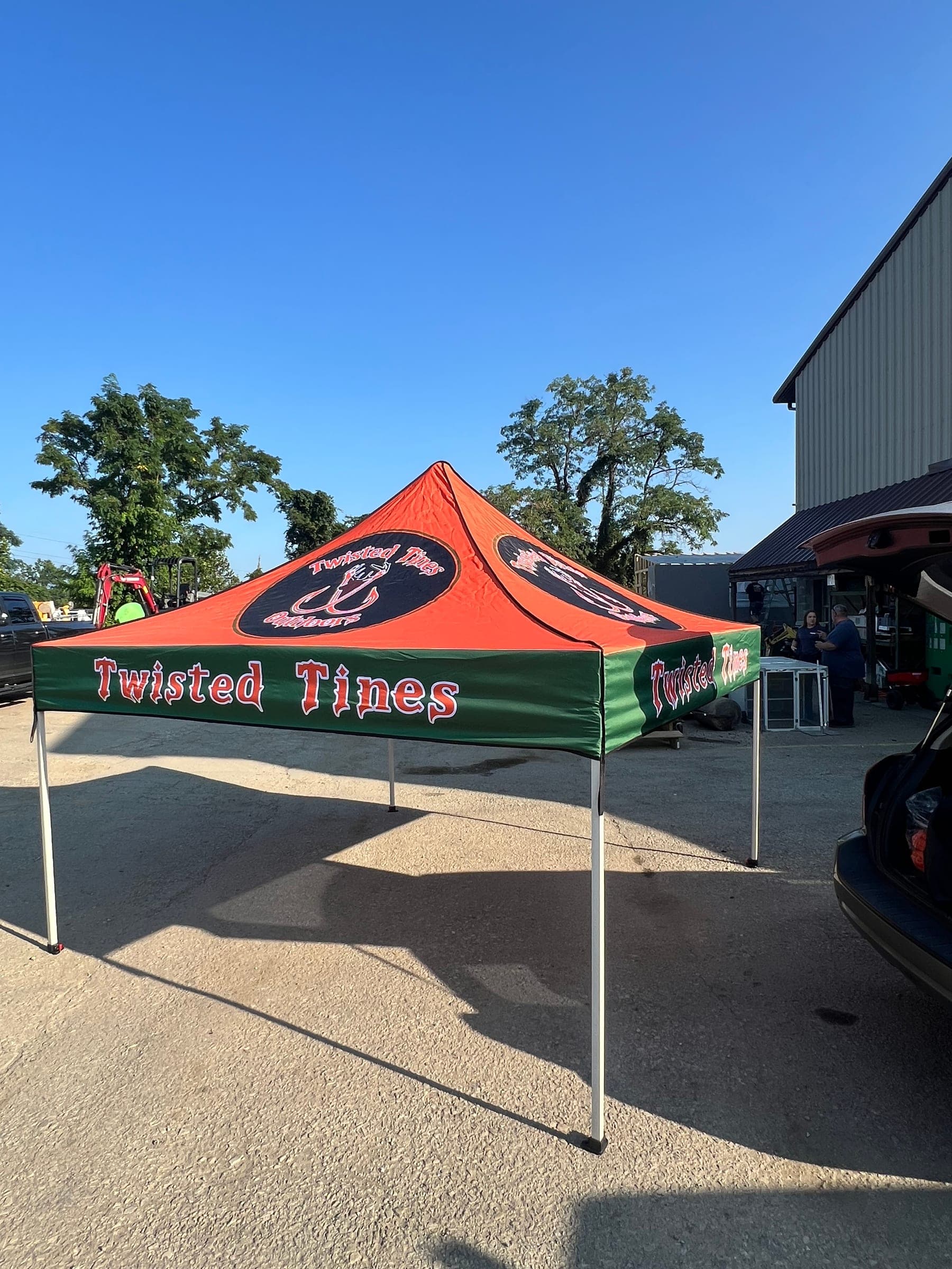 Custom printed orange and green canopy tent for Twisted Tines