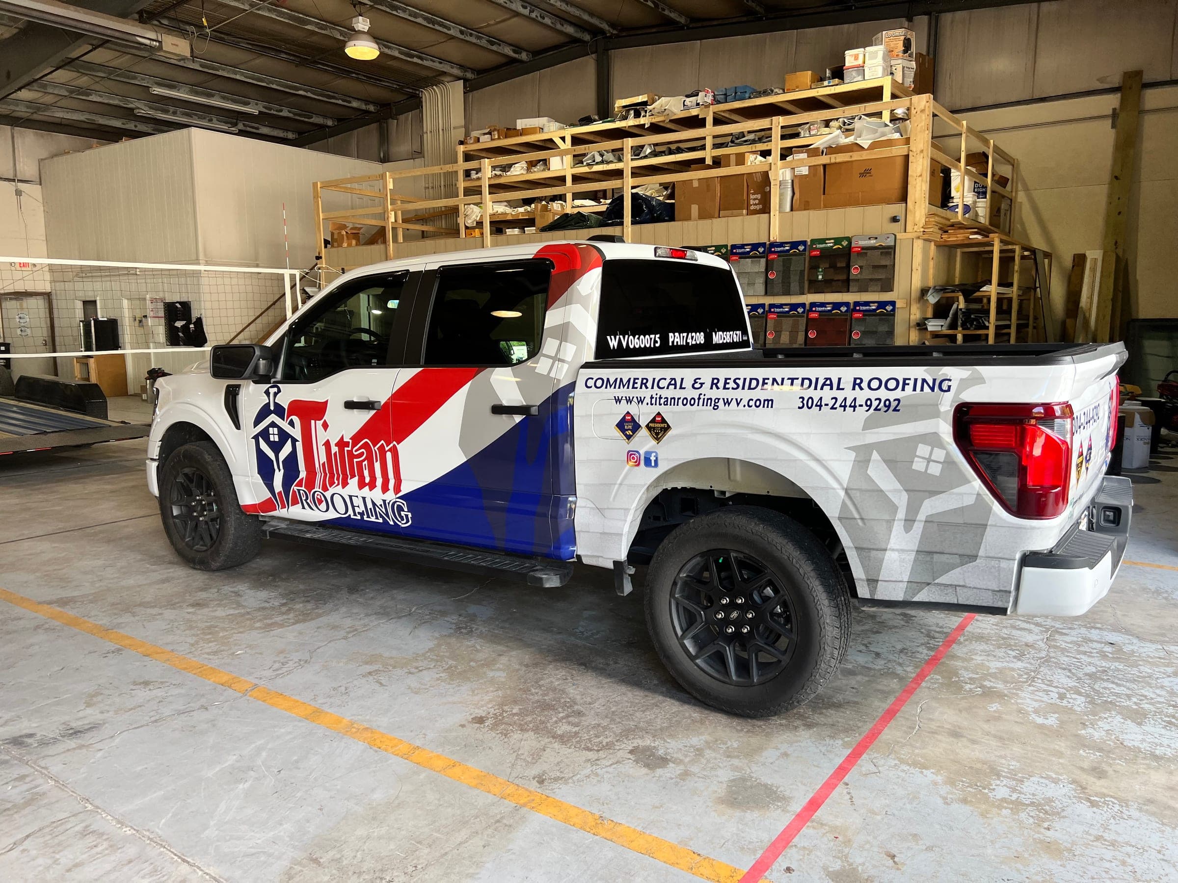 Pickup truck with a full red, white, and blue wrap for Titan Roofing